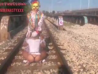 Clown almost gets hit by train while getting head
