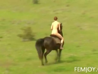 Busty Redhead Abby Rides A Horse Nude